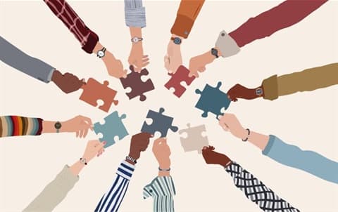 Multicultural Advisory Group — diverse hands holding puzzle pieces together